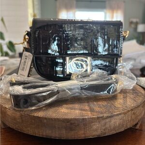 Bebe Black Patent leather Crossbody Bag with gold accents Chain and Glossy. NWT
